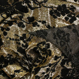 Maille lurex fleurs noires velours fond doré