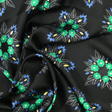 Satin polyester imprimé fleurs vertes fond noir