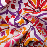 Polycoton imprimé faïence rose, violet et moutarde fond blanc