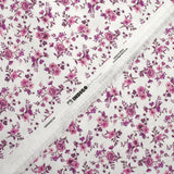 Piqué de coton imprimé les fleurs de Louna violet fond blanc