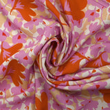 Viscose imprimée ombre florale parme et orange fond beige