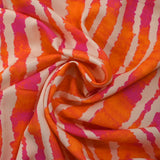 Viscose imprimée rayée effet tie & dye orange et fuchsia