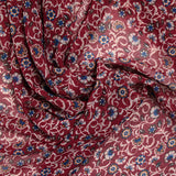 Mousseline crinkle imprimée fleurs fond lie de vin