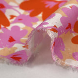 Viscose imprimée ombre florale parme et orange fond beige