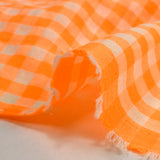 Seersucker vichy naranja neón y crudo