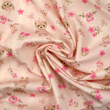 Coton imprimé ours et santiag fleurie fond rose