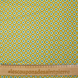 Viscose imprimée fleurs graphiques bleues fond jaune soleil
