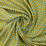 Viscose imprimée fleurs graphiques bleues fond jaune soleil