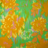 Satin de viscose imprimé brume florale moutarde fond vert