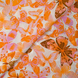 Viscose imprimée jacquard papillons lilas et orange fond blanc