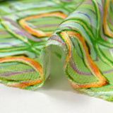 Satin de viscose imprimé disco retro fond vert