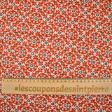 Coton matelassé double face fleurs et arabesque marron au mètre