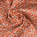 Coton matelassé double face fleurs et arabesque marron au mètre
