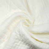 Matelassé variation de losanges blanc cassé