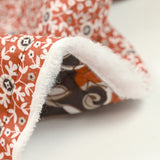 Coton matelassé double face fleurs et arabesque marron au mètre