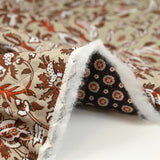 Coton matelassé double face cercle et fleurs marron au mètre