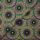 Coton imprimé ethnique Haarlem orange et jaune fond vert