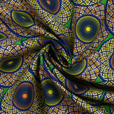 Coton imprimé ethnique Haarlem orange et jaune fond vert