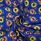 Coton imprimé ethnique Kampen orange et jaune fond bleu roi