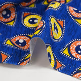 Coton imprimé ethnique Kampen orange et jaune fond bleu roi