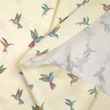 Coton imprimé envolée de colibris fond écru