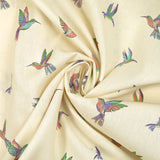 Coton imprimé envolée de colibris fond écru