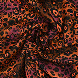 Viscose imprimée léopard orange fluo fond marron