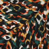 Satin de viscose imprimé Vénus orange brûlé fond noir