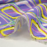 Satin de viscose imprimé disco retro fond parme