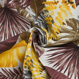 Polycoton imprimé jungle de feuilles jaune et marron fond blanc