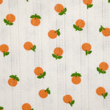 Jersey pointelle coton imprimé orange fond blanc cassé