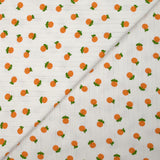 Jersey pointelle coton imprimé orange fond blanc cassé