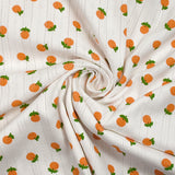 Jersey pointelle coton imprimé orange fond blanc cassé