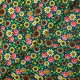 Cotton printed field of daisies with petroleum background