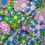 Coton imprimé flower power parme fond violet