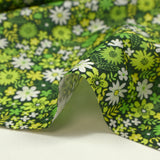 Cotton printed meadow in flowers anise dark green background