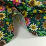 Cotton printed field of daisies with petroleum background