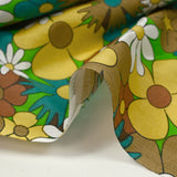 Turquoise, brown and buttery yellow disco flower print cotton