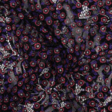 Dentelle festonnée imprimée fleurs rouge et violette fond noir