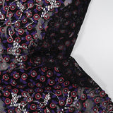 Dentelle festonnée imprimée fleurs rouge et violette fond noir
