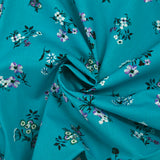 Popeline de coton imprimée bouquet champêtre fond turquoise