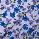 Popeline de coton imprimée fleurs grimpantes fond à pois mauve