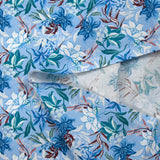 Popeline de coton imprimée fleurs des mers fond bleu clair
