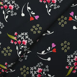 Popeline de coton imprimée archipel floral fond noir