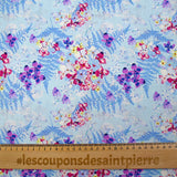 Cotton poplin printed with the shade of ferns on a baby blue background