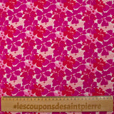 Popeline de coton imprimée fleurs en fusion fuchsia et magenta fond écru