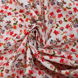 Popeline de coton imprimée fleurette dans le vent rouge fond blanc