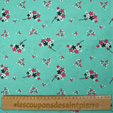 Popeline de coton imprimée souffle fleuri fond aqua