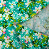 Popeline de coton imprimée jasmin fond turquoise