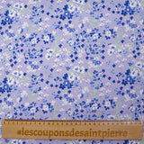 Popeline de coton imprimée nuage de myosotis fond lavande